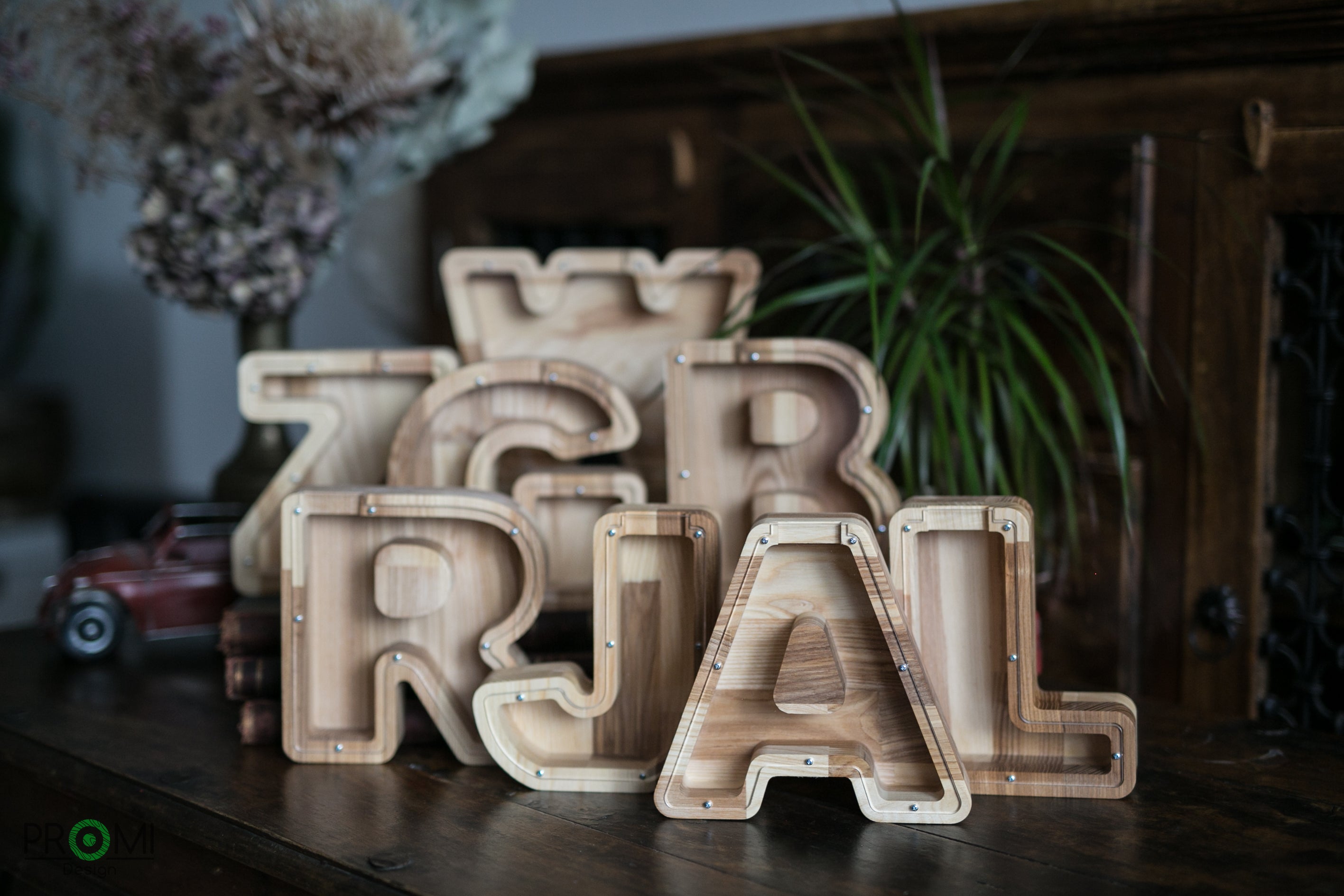 This is a personal LETTER money box crafted from a beautiful ash tree wood. Your chosen letter money bank could be a perfect gift for a newborn baby, your child or just any person you wish to surprise with this original gift!