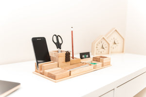 This ALL IN ONE desk organizer made from a single piece of oak wood contains everything that you may need on your desk. One big platform holds 8 different wooden boxes/containers of various sizes.